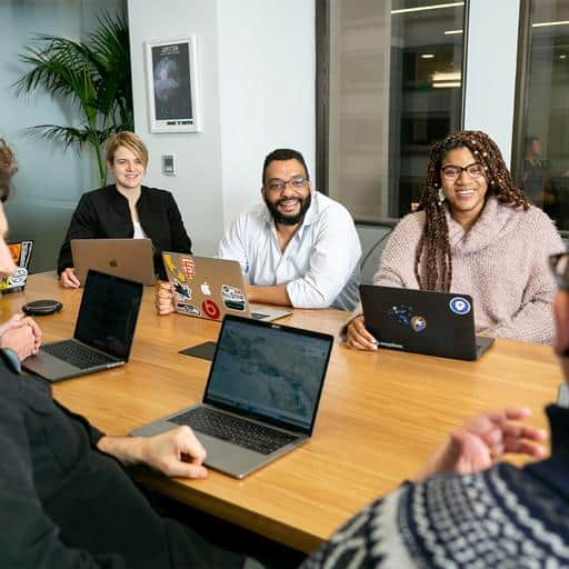 Team meeting in conference room discussing managed service provider solutions.
